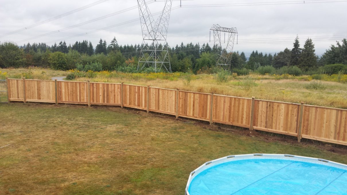 cedar fence around pool, wood fences, property value, fencing project